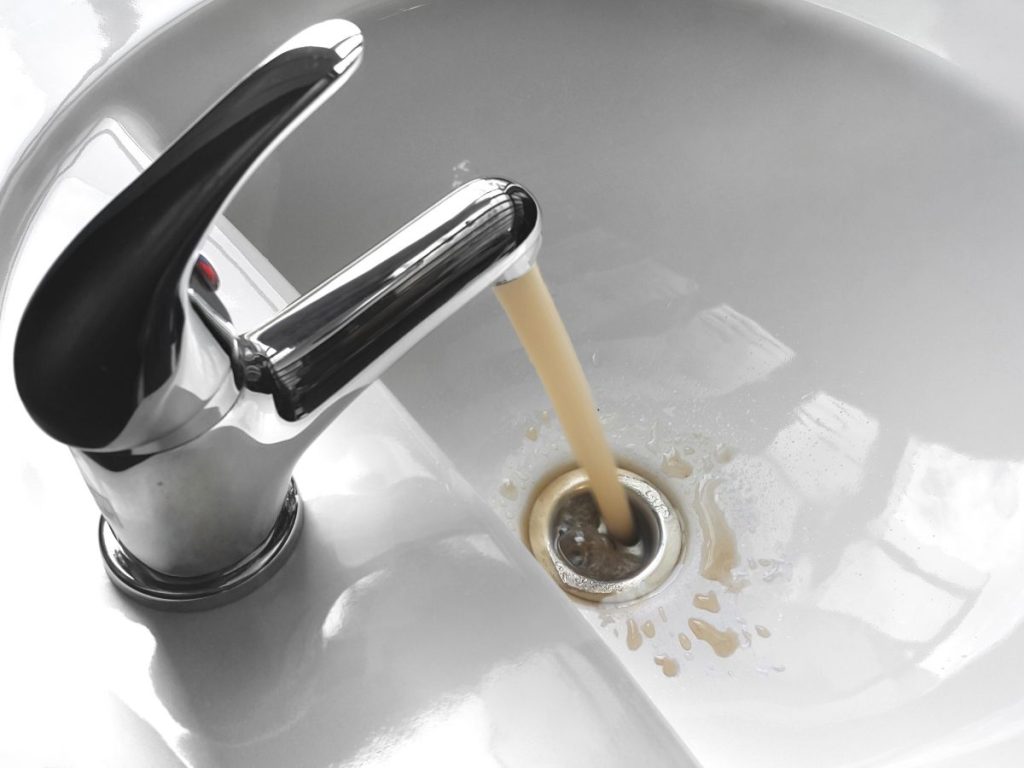 Dirty water tank with sediment buildup Doha